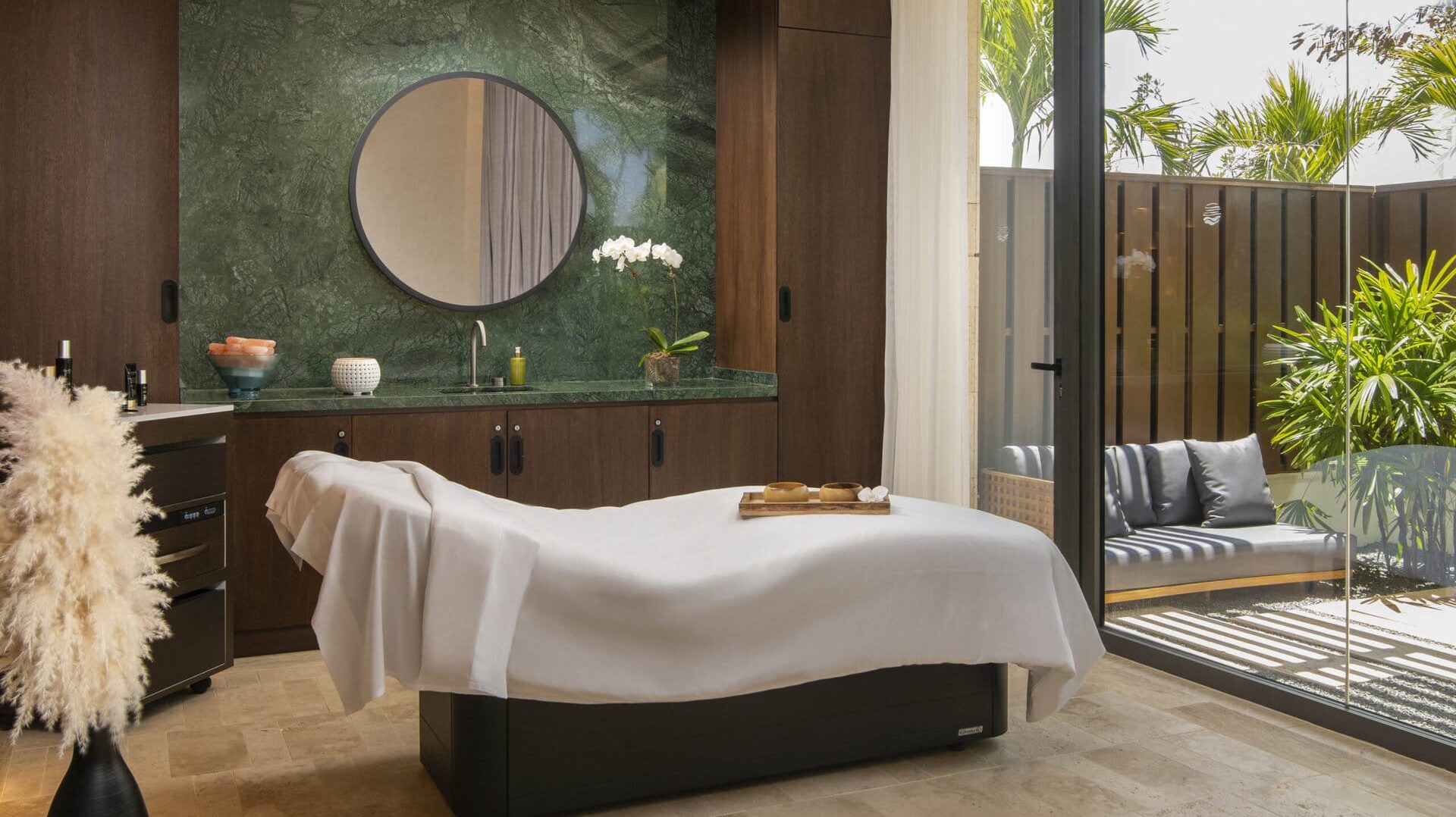 A relaxing spa room with an outdoor zen patio at Casa de Campo Resort